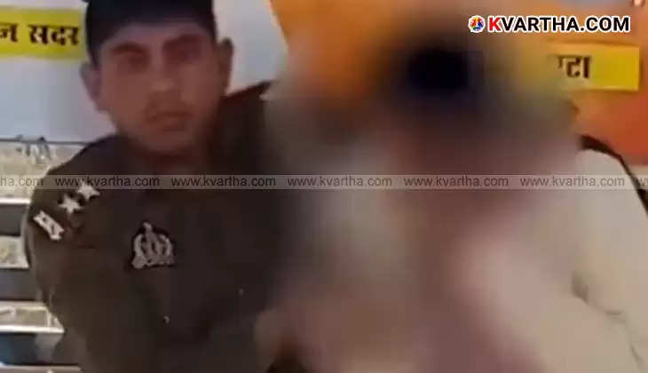  A UP police officer in uniform is seen abusing his wife in public in Kanpur.