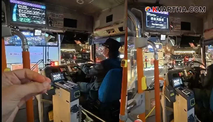 Interior of a Japanese bus showing digital display and passenger seats