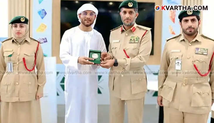 Shahvez Khan receiving award from Dubai Police officer at Dubai Police headquarters