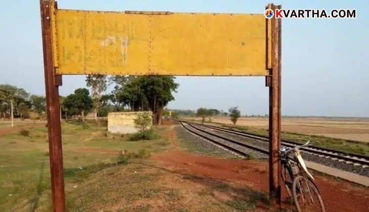 A yellow signboard at a railway station with no name, indicating the unique situation of India's only nameless station.